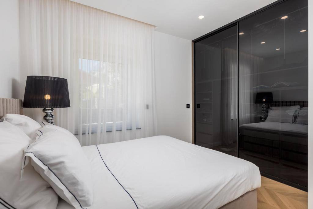 Bedroom with wardrobe and sheer curtains